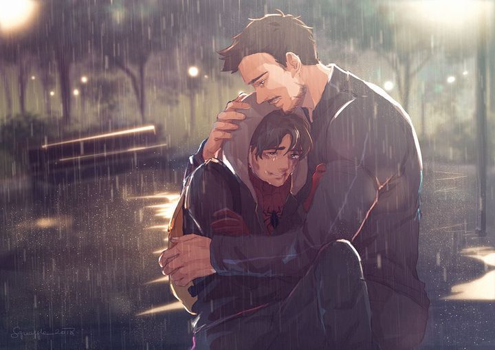 two people are hugging in the rain with one holding an umbrella and the other looking down