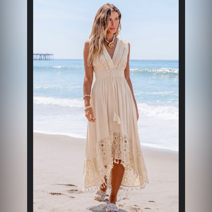 Brand New With Tags Beige Lace & Tassel Sleeveless Midi Dress Size : Large Color: Cream Bust:37.5-39.5in Waist:29.2-31.2in Hip:40.2-42.1in Gorgeous, Super Fun, Cozy Dress V-neck Dress With Back Tassel Tie-up For Summer, Bohemian Sleeveless Maxi Dress With Back Tassel Tie-up, Summer V-neck Dress With Tassel Ties, Sleeveless Summer Dress With Back Tassel Tie-up, Sleeveless Maxi Dress For Beach Wedding In Spring, Beige Sleeveless Dress For Beach Season, Beige Sleeveless Sundress For Beach Season, Sleeveless Beige Beach Dress For Beach Party, Chic Sleeveless Beige Beach Dress