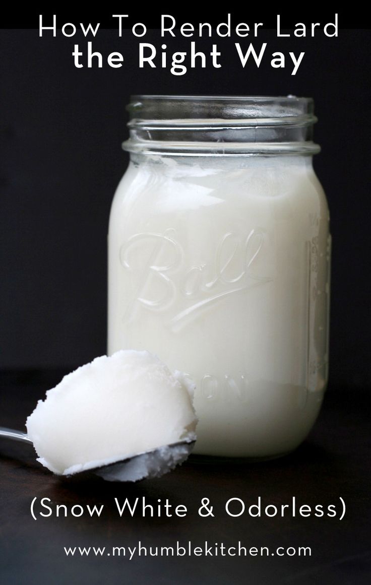 a glass jar filled with white and oatmeal next to a spoon