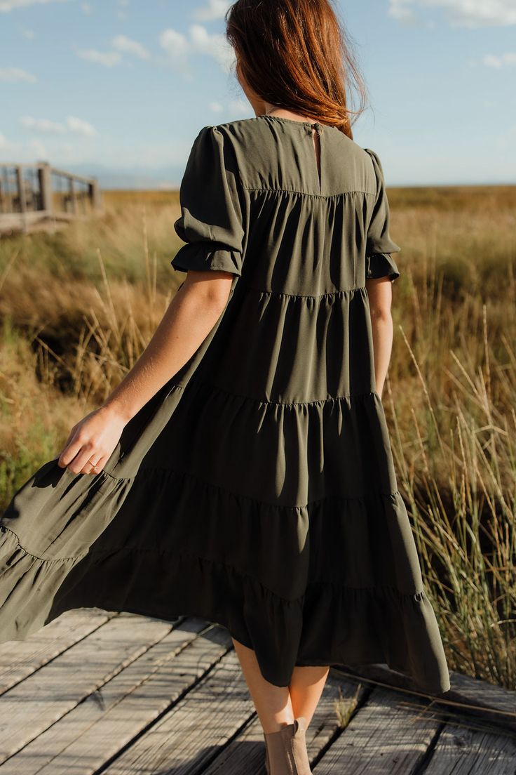 This midi-length floral dress is covered in tiered details, flow and fabric that is equal part durable and lightweight. The puffy sleeves have an elastic at the bottom to create a ruffle effect and add extra volume. We are loving neutrals for fall and this dress has it all. This dress was exclusively made for twirling your way to the farmers market. *Fabric has no stretch. Size up if in between sizes. Otherwise true to size.* Material Content: 94% Polyester // 6% Spandex Material Pattern: Solid Horseshoe Necklace Gold, Pear Body Shape, Striped Socks, Puffy Sleeves, Light Denim, Favorite Dress, Farmers Market, Boutique Clothing, Black Tee