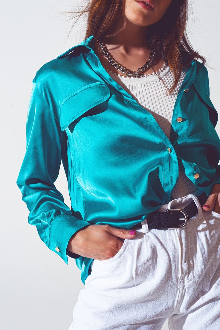 Elevate your style with the Satin Blouse in Turquoise from Szua Store. Made with a luxurious blend of 55% rayon, 43% viscose, and 2% spandex, this satin blouse offers a relaxed fit, perfect for party occasions. Model is wearing size S, with measurements 33-24-35 and a height of 5'8''. Running true to size, this exquisite blouse features a wide collar neckline, long sleeves, and button cuffs. Designed for a relaxed fit, this party-ready satin blouse also comes with chest pockets and a button plac Statement Blouse, Blouse Neck, Blue China, Satin Blouse, Tailored Trousers, Belted Dress, Alternative Fashion, Satin Fabric, Casual Chic