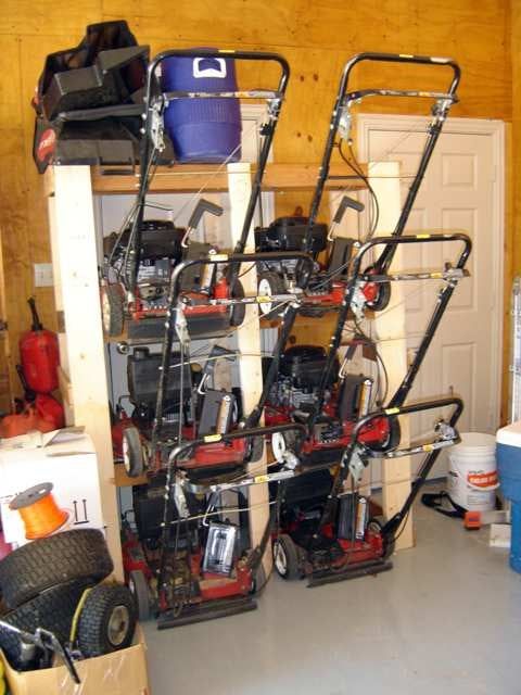 a garage filled with lots of different types of tools and equipment in it's storage area