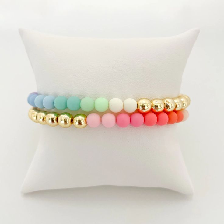 Pastels and gold? Yes, please! Our best-selling Gold Bead bracelet gets a pretty pop of color thanks to our pastel acrylic beads. Add to your stack or wear alone but either way, these bracelets will pretty up your arm party! Bracelet measures 7" in circumference. If you need a custom length, please send an email to hel Gold Bead Bracelet, Pop Collection, Arm Party, Gold Bead Bracelets, Sell Gold, Jewel Box, Acrylic Beads, Bead Bracelet, Gold Beads