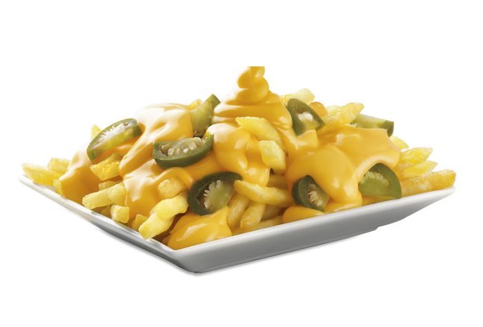 a white plate topped with cheese covered pasta and jalapeno slices on top of it