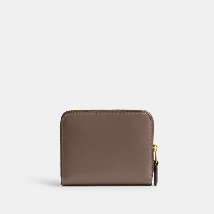 Crafted of refined leather this compact billfold wallet features a convenient exterior zip pocket for coins receipts earbuds and other small essentials. It unsnaps to reveal eight card slots and a full-length bill compartment. | Coach New York Billfold Wallet - Women's - Brass/dark Stone Modern Compact Coin Purse For Business, Modern Compact Business Coin Purse, Classic Coach Coin Purse With Coin Pocket, Classic Compact Coach Coin Purse, Classic Coach Coin Purse, Classic Coach Coin Purse For Everyday Use, Coach Leather Coin Purse With Coin Pocket, Modern Coach Wallets With Interior Card Slots, Classic Coach Leather Coin Purse