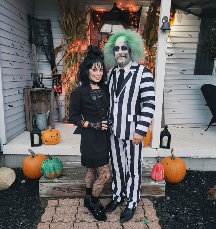 a man and woman dressed up as beetlejuice and jack skellingy for halloween