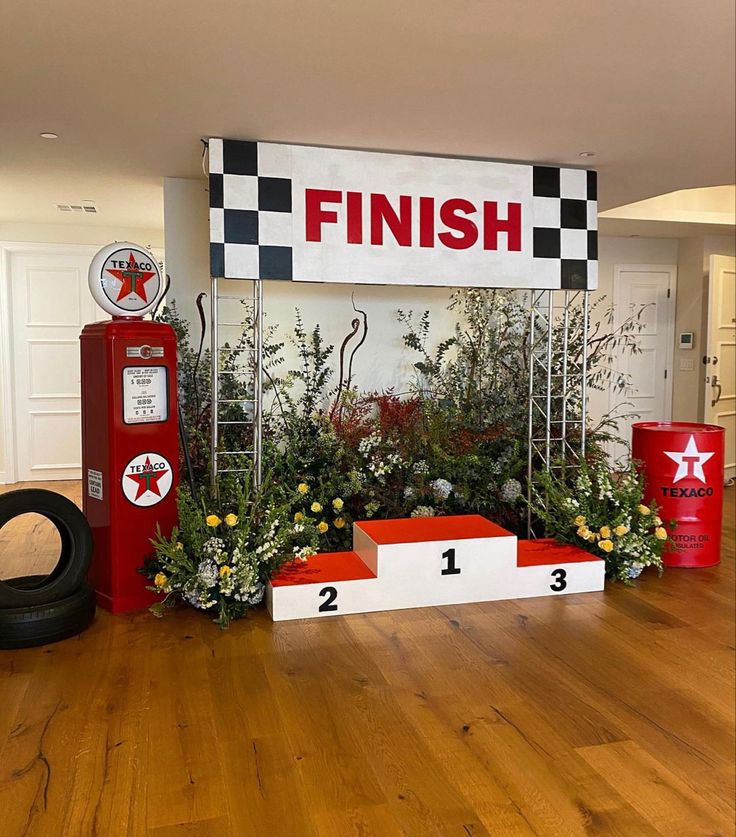 the finish line is decorated with flowers and tires