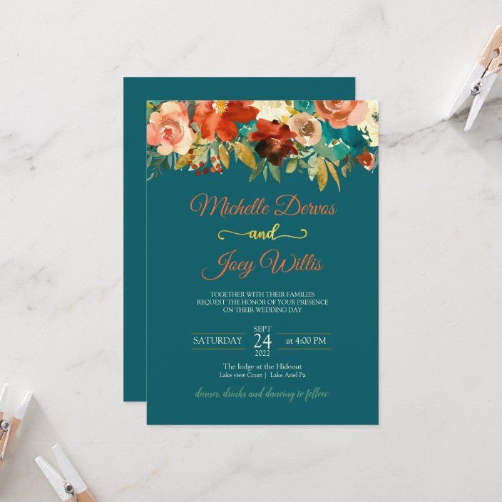 a wedding card with watercolor flowers and gold foil lettering on the front, in teal blue