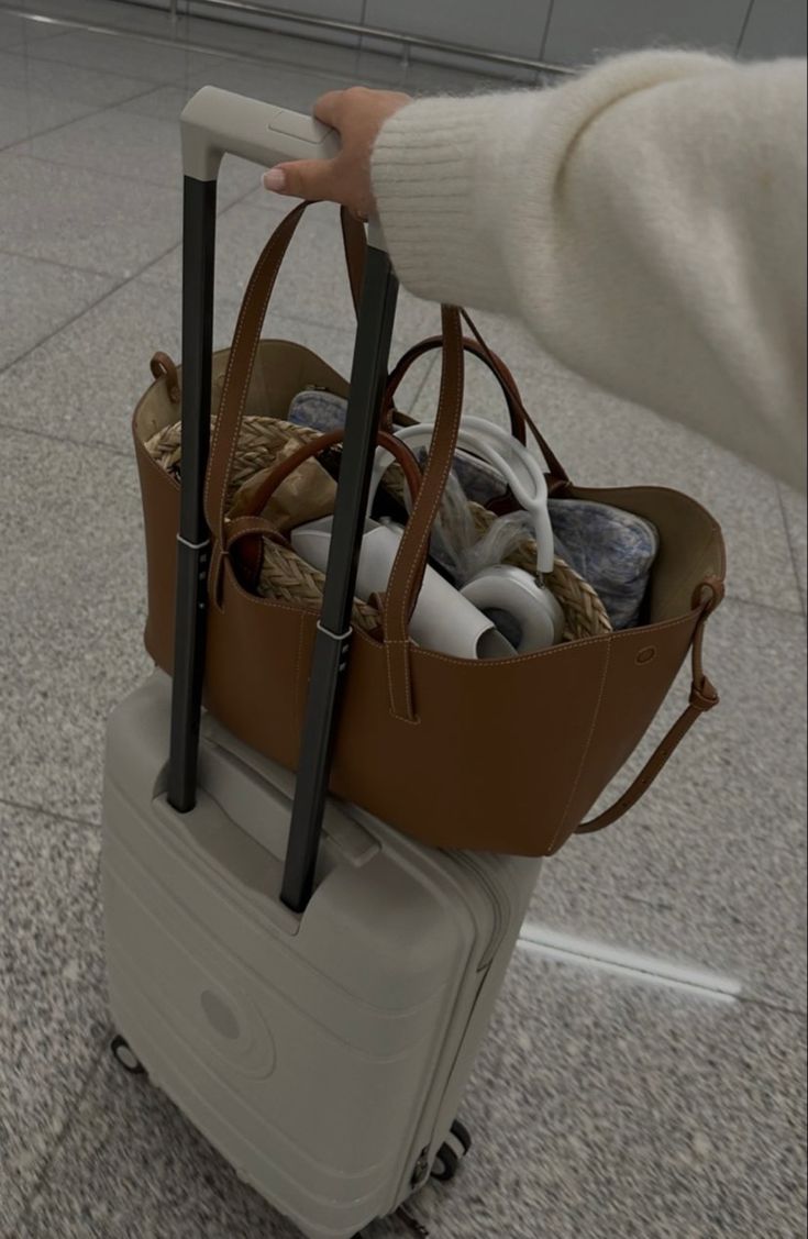 a person is holding a bag full of stuff