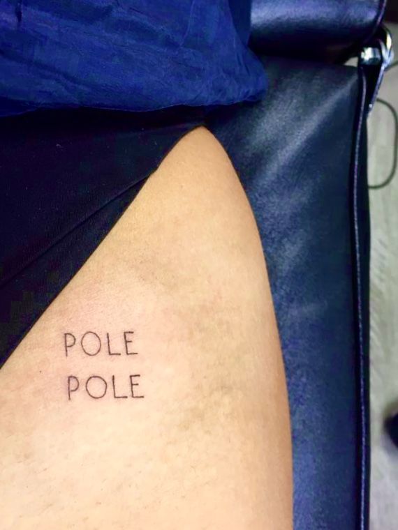 a woman's leg with the word pole pole tattooed on her left side thigh