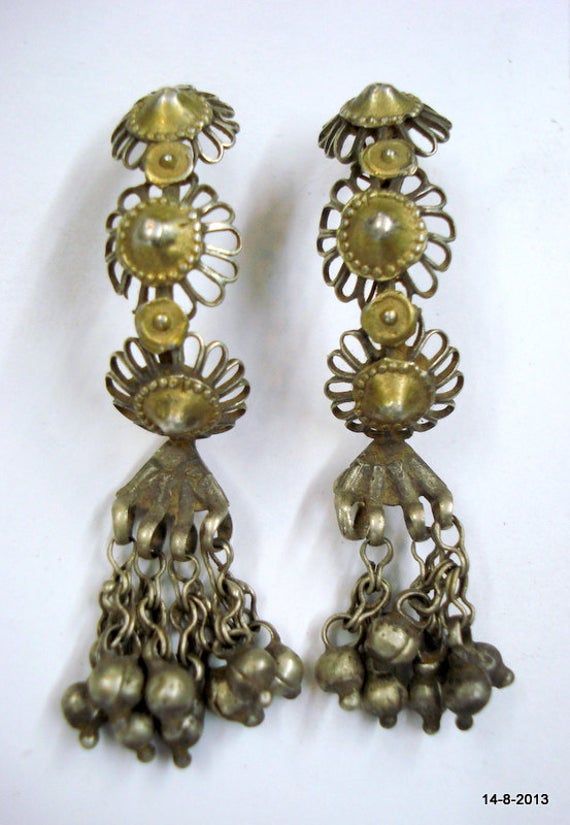 "Vintage Antique tribal old silver earring pair from Rajasthan India. Worn by tribal people of Rajasthan. Beautiful workmanship all over the pieces and adorn with silver bells. Nice old worn pair good for jewellery collection. Length - 5.5 cm (2.16\") Weight - 10.5 grams Material - Silver and original old worn pair." Traditional Silver Bell Earrings, Traditional Silver Earrings With Bells, Bohemian Jhumkas For Ceremonial Festivals, Bohemian Bell Earrings For Festivals, Bohemian Festival Earrings With Bells, Traditional Silver Brass Jhumkas, Traditional Silver Jewelry With Bells, Bohemian Jhumkas For Festivals, Traditional Antique Silver Earrings For Festivals