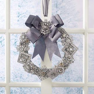 a wreath hanging on the side of a window