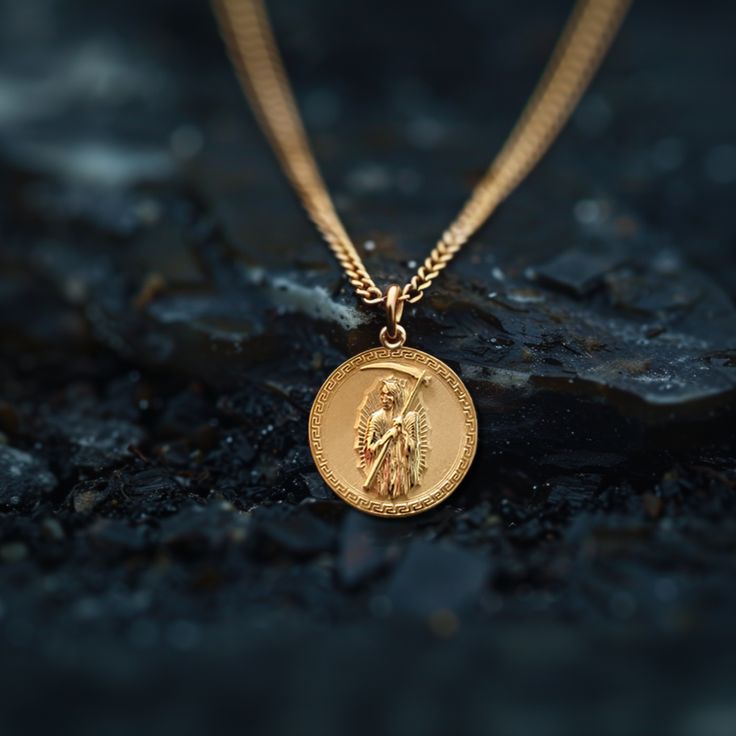 Our Gold Santa Muerte Pendant, crafted in the USA from real solid gold, embodies devotion and protection. This timeless piece showcases exquisite craftsmanship, designed to last a lifetime. Perfect for those seeking a unique and meaningful symbol, this pendant is a testament to enduring quality and elegance. PENDANT INFORMATIONThis pendant is made of real, solid gold.• Made in USA• Material: 14k or 18k solid gold• Finish: polished• Height: 1.13" (29 mm) x Width: 1" (26 mm)• Pendant weight: appro Spiritual Recycled Gold Round Pendant Jewelry, Spiritual Round Recycled Gold Jewelry, Recycled Gold Spiritual Jewelry, Spiritual Jewelry In Recycled Gold, Spiritual Recycled Gold Jewelry, Spiritual Gold Plated Round Jewelry, Spiritual Round Gold Plated Jewelry, Spiritual Recycled Gold Pendant Jewelry, Spiritual Yellow Gold Recycled Jewelry