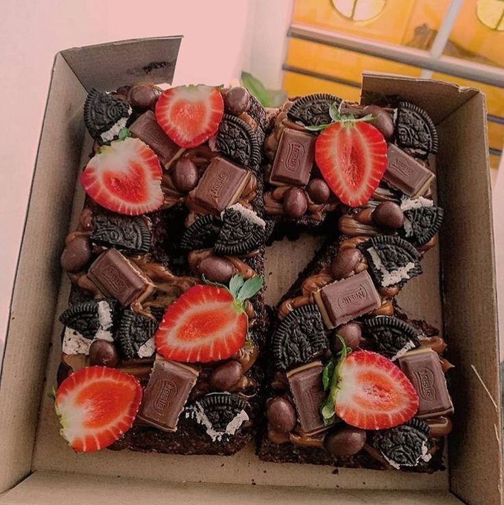 a box filled with lots of chocolate and strawberries