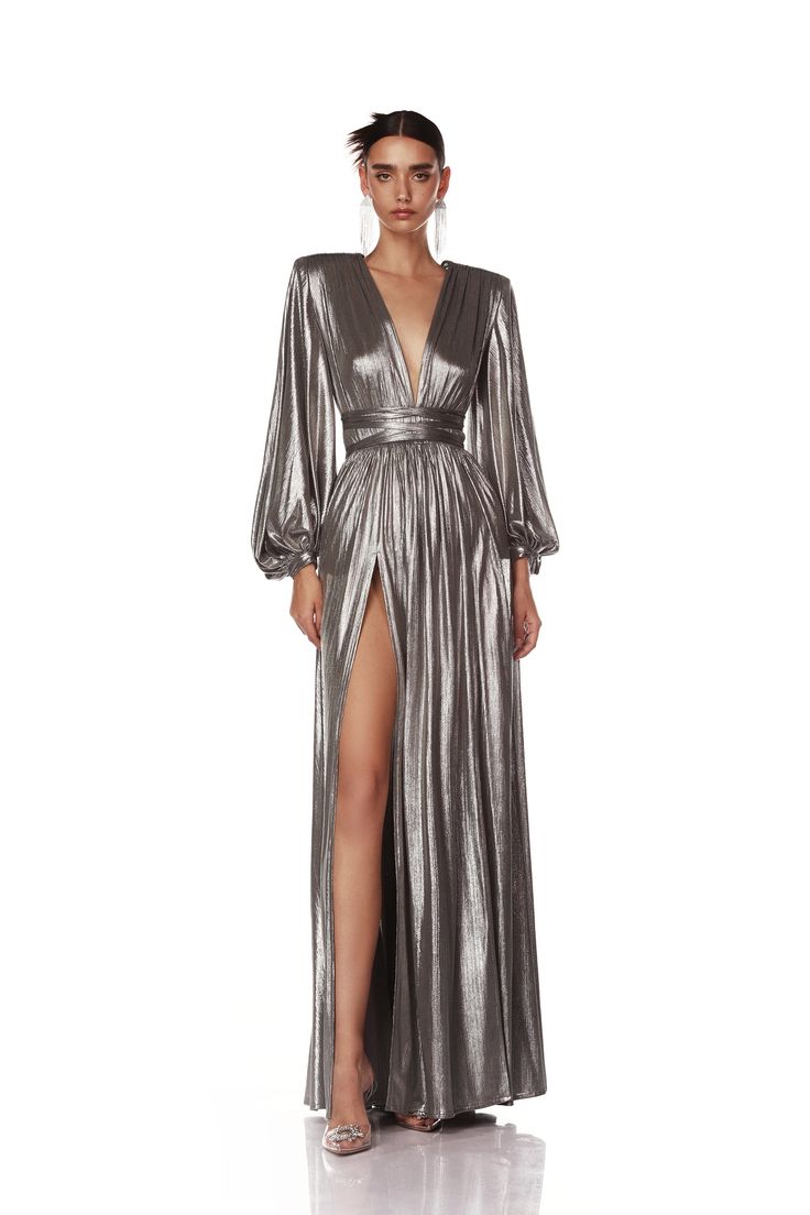 Buy the Beautiful Gorgias Zoe Silver Gown for any kind of party, wedding, and occasion from Bronx and banco. Similar products are available. Glamorous V-neck Evening Dress With Back Opening, Luxury V-neck Maxi Dress For Gala, V-neck Evening Dress With Side Slits For Party, Luxury Long Sleeve Gown For Night Out, Luxury V-neck Evening Dress For Night Out, Glamorous Long Sleeve Cocktail Gown, Glamorous V-neck Gown With Back Opening, Glamorous Evening Gown With V-neck, Glamorous Long Evening Gown