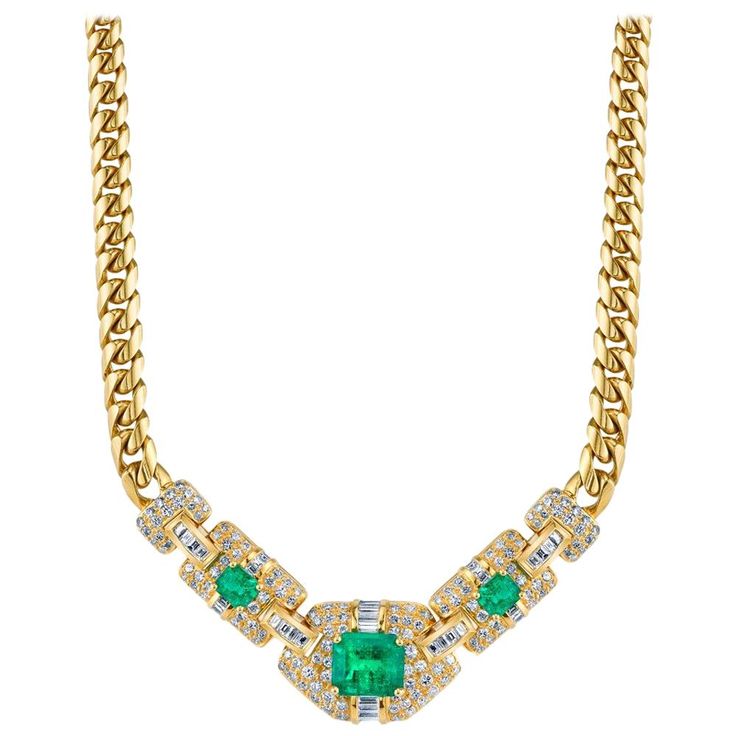 An elegant emerald diamond necklace featuring a 4.35 carat vivid green emerald cut emerald which we believe to have Columbian origin. Two smaller emeralds complement the centerpiece which is covered in approximately 4.50 carats of baguette and full-cut diamonds, set in 18k yellow gold. Necklace Length: 16.5 inches Luxury Emerald Diamond Necklace With Brilliant Cut, Emerald Cut Green Diamond Necklace, Green Emerald-cut Diamond Necklace, Green Emerald Baguette Cut Necklace, Luxury Emerald-cut Emerald Diamond Necklace, Flowers Rings, Emerald Diamond Necklace, Diamond Gold Necklace, Silver Gold Necklace