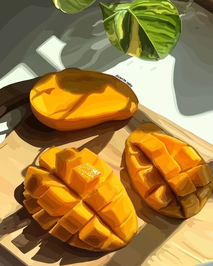 a close up of sliced mangoes on a cutting board