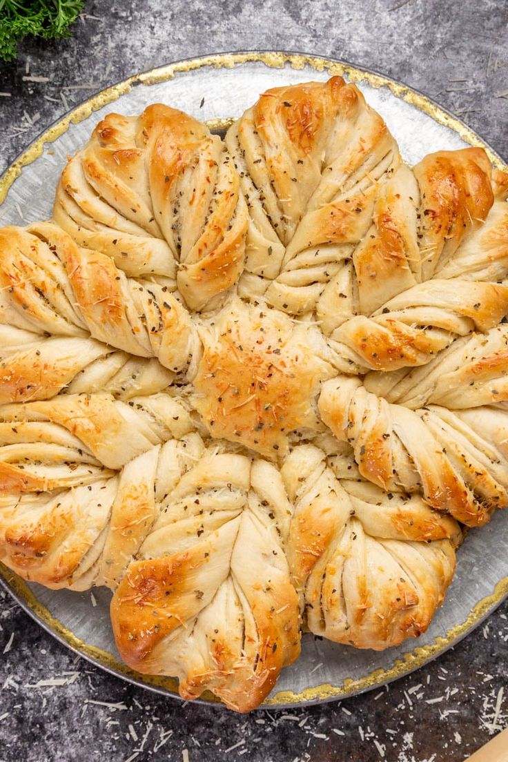 a platter filled with bread on top of a table