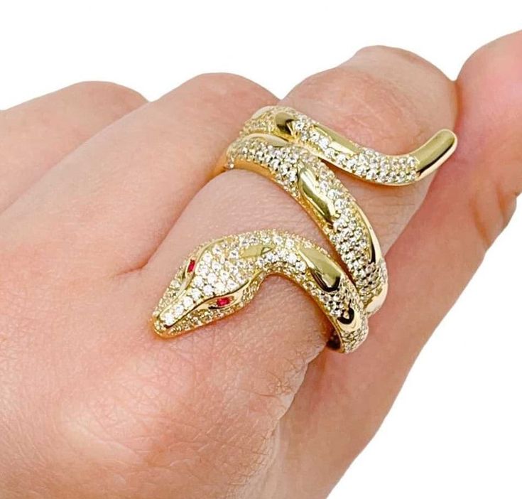 MY GOLD SOURCE 14k Gold Fancy CZ Snake with Scales and Red Eyes Ring Size 8.75 PRODUCT DETAILS - METAL: 14K YELLOW GOLD (100% Authentic) - CONDITION: NEW -STONE: CUBIC ZIRCONIA -RING FINGER SIZE: 8.75 -APPROX. WEIGHTS: 7.0 grams This is a Stunning Real 14K Yellow Gold Fancy Snake with Scales Ring! It is Extremely Fashionable and dainty. -note all weights and dimensions are approximate- -Refer to image to see details- -Returns accepted within 30 Days after receiving the item- MY GOLD SOURCE Gold Ruby Jewelry With Pave Setting, Gold Ruby Rings With Pave Setting, Party Yellow Gold Jewelry With Pave Setting, Yellow Gold Diamond Ring In Snake Shape, Gold Ruby Ring Stamped 14k, Gold Ruby Rings With Diamond Cut, Snake-shaped Yellow Gold Jewelry For Anniversary, Gold Fine Jewelry Snake-shaped Ring, Gold Snake Ring With Diamond Accents As Gift