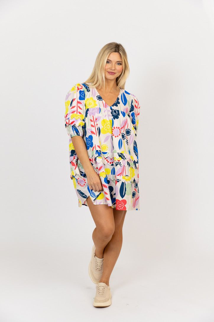 This Multi Abstract Vneck Scallop Dress is a must-have for summer! With a vibrant floral print and elegant scallop detail, this dress is sure to make a statement. The flattering vneck design provides an easy fit to your body that's sure to turn heads. Multicolor V-neck Floral Dress With Vibrant Print, Multicolor Floral Print V-neck Dress, Spring Floral Print V-neck Dress For Vacation, Floral Print V-neck Dress For Summer Brunch, Spring Floral V-neck Dress With Vibrant Print, White Floral Print Mini V-neck Dress, Printed V-neck Spring Vacation Dress, Multicolor Floral Print V-neck Dress For The Beach, Multicolor Floral V-neck Dress With Vibrant Print