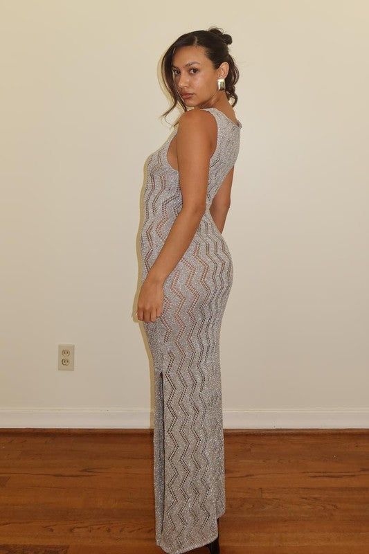 Sparkle and shine in our Silver Metallic Crochet Knit Dress! This stunning formal dress also doubles as a stylish cover-up. Its shiny, beautiful design will make you stand out and feel confident at any event. Make a statement with this must-have dress! Model is wearing a size small Elegant Stretch Knit Maxi Dress, Sleeveless Knit Party Dress, Fitted Knit Maxi Dress For Party, Long Knit Party Dress, Chic Knit Midi Dress For Party, Chic Knit Maxi Dress For Parties, Elegant Party Crochet Dress, Knit Midi Party Dress, Knit Midi Dress For Party