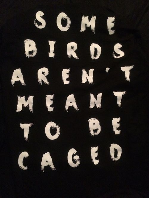 some birds aren't meant to be caged on a black tee - shirt