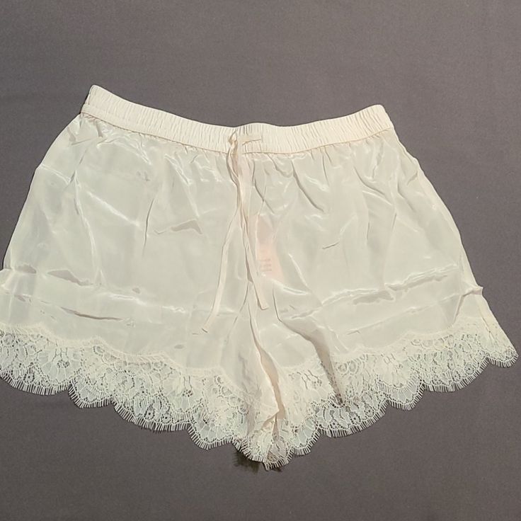 Bnwt, Satin Coco White Color. Size Small, Chemise Shorts, Very Comfy, Never Been Worn. Beautiful Lace On Bottom, As Shown/Sexy Sheer Feminine Bottoms For Summer, Sheer Feminine Summer Bottoms, Feminine Sheer Bottoms For Summer, Summer Sheer Feminine Bottoms, Cream Lace Trim Bottoms For Loungewear, Feminine Pajama Shorts, Feminine Pajama Shorts For Daywear, Feminine Daywear Pajama Shorts, Feminine Short Pajama Shorts For Bedtime