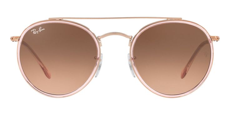 RAY-BAN RB3647N 9069A5This round Ray-Ban sunglass comes in a pink frame with pink gradient brown lenses.Ray-Ban is an iconic eyewear brand that has been at the forefront of sunglasses fashion since its establishment in 1937. With a legacy spanning decades, Ray-Ban has become synonymous with timeless style, exceptional quality, and innovation in eyewear design.Ray-Ban sunglasses are instantly recognizable and have achieved iconic status in popular culture. The brand's collections feature a range Modern Rose Gold Sunglasses With Gradient Lenses, Modern Pink Sunglasses With Gradient Lenses, Pink Round Frame Polarized Sunglasses, Pink Sunglasses With Mirrored Lenses And Round Frame, Pink Round Frame Sunglasses With Mirrored Lenses, Pink Round Frame Sunglasses For Spring, Modern Pink Aviator Sunglasses For Spring, Rose Gold Sunglasses With Gradient Lenses For Summer, Rose Gold Tinted Sunglasses For Spring