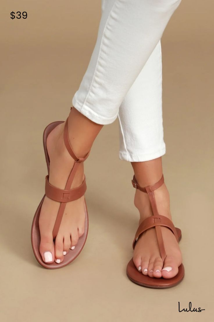 Add a pop of cute to your outfit with the Lulus Colleen Cognac Vachetta Leather Flat Sandals! Sleek vachetta leather forms these cute sandals with a T-strap upper and matching, adjustable ankle strap with gold buckle. 0. 25" rubber heel. Lightly cushioned insole. Rubber sole has nonskid markings. Genuine leather upper. Balance man made materials. Imported. Lulus | Colleen Cognac Vachetta Leather Flat Sandal Heels. Elegant Brown Leather Sandals, Lacoste Shoes Women, Cognac Sandals, Heel Sandals Outfit, Pretty Sandals, Nice Sandals, Toe Loop Sandals, Dressy Sandals, Sandals Outfit