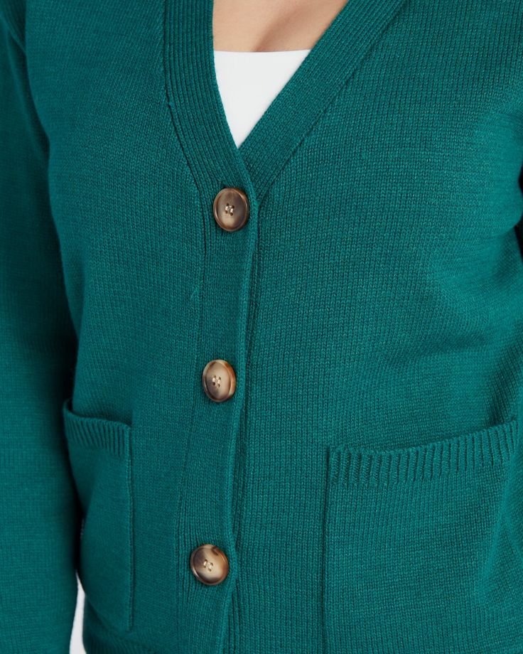 Give your cozy days a pop of cheery color! This cardigan knows how to do it. Roomy fit with dropped sleeves, handy pockets and a button-up front. Made of medium-weight recycled polyester yarn. | Recycled Cardigan Top for Women in Marigold, Size Medium by Skies Are Blue from Wantable