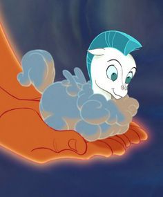 an animated cat laying on its back in the palm of someone's hand with blue hair