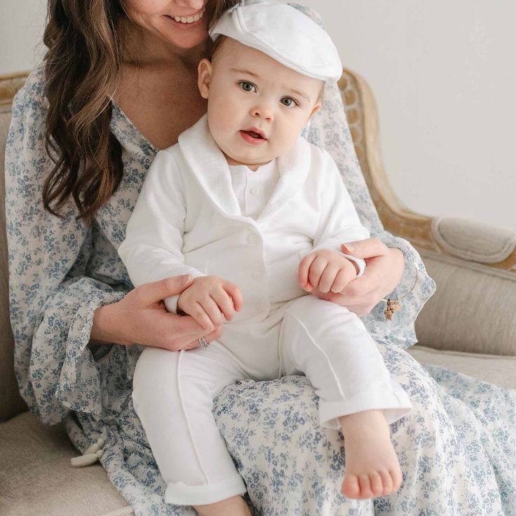 Baby boy sitting on his mother's lap. He is wearing the Miles 3-Piece Suit, including the jacket, pants, and onesie Baby Boy Dress Clothes, Miles Baby, Stylish Baby Boy, Boy Baptism Outfit, Unique Baby Clothes, Boy Dress, Baby Boy Dress, India Dress