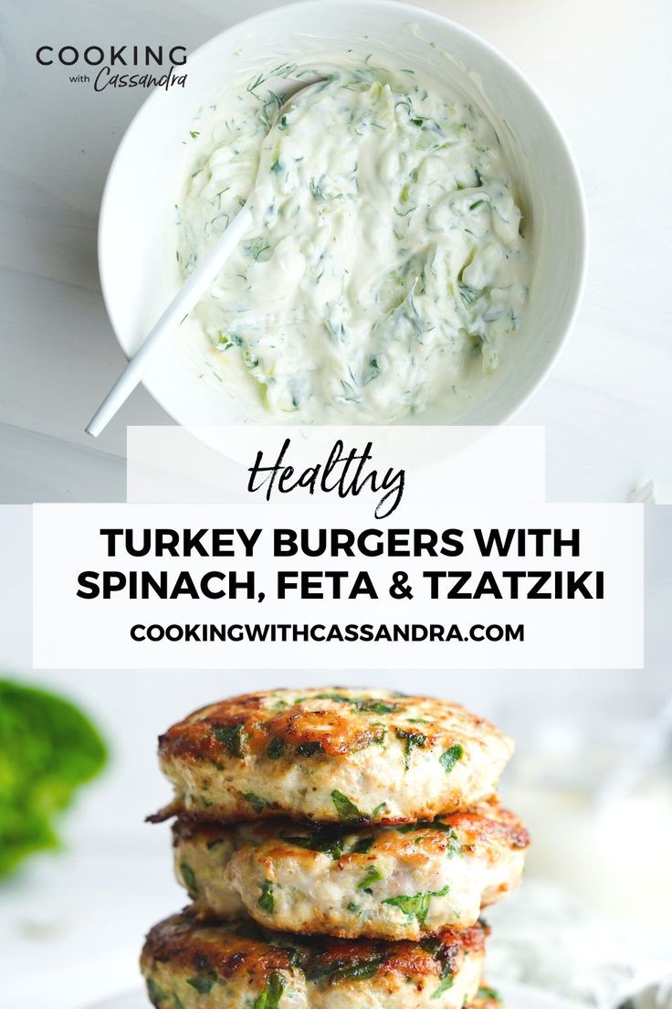 turkey burgers with spinach, feta and tzatzki on a plate