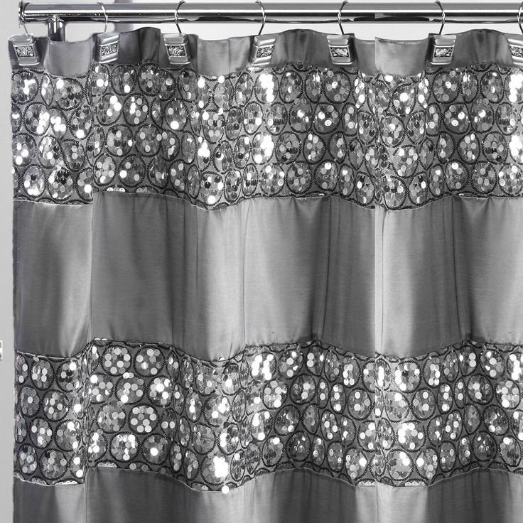 a shower curtain with silver sequins on it