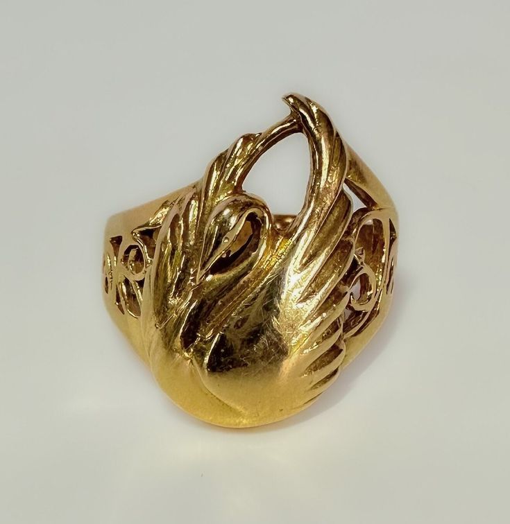 Art Nouveau c1930s This beautifully made Nouveau era ring, with a few Victorian elements - a fine example of transitional design. The details I. The Swan are fluid and very pretty. The scroll work is clearly hand wrought. An elegant piece. 5.6g 14k solid yellow gold Hallmarked Swan measures 19 x 13mm Shank tapers from 9mm to 3mm S 6.5 US resizable Very fine antique condition Gold Art Nouveau Ring For Formal Occasion, Art Deco Yellow Gold Filigree Ring, Vintage Gold Jewelry With Artistic Design, Art Nouveau Yellow Gold Round Ring, Art Nouveau Engraved Yellow Gold Ring, Art Nouveau Yellow Gold Jewelry For Anniversary, Art Nouveau Yellow Gold Collectible Rings, Yellow Gold Art Nouveau Jewelry For Anniversary, Collectible Art Nouveau Yellow Gold Ring