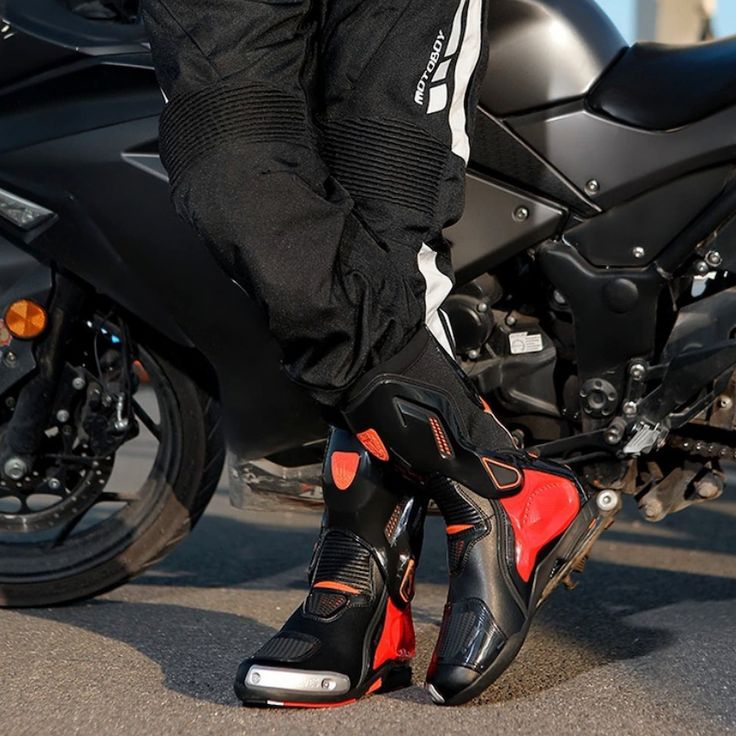 For the Ride of Your Life When it comes to protecting yourself on the road, riding boots are second only to your helmet. Designed with slip-resistant soles and reinforced with PVC and metal panels, these boots minimize impact during falls and shield your ankles when the bike tips over. The quick-release zippers make them easy to put on and take off, so you’re always ready to ride. Choose Your Version: Perforated Version: Perfect for warmer climates, offering enhanced breathability. All-Season Ve Black High-top Shock Resistant Boots, Black Waterproof Biker Boots For Motorcycling, Black Biker Waterproof Boots For Motorcycling, Black Biker Style Waterproof Boots For Motorcycling, Winter Boots With Shock Resistant Round Toe, Black Biker Work Boots For Outdoor, Winter Boots With Shock Resistant And Round Toe, Winter Boots With Shock Resistance And Round Toe, Black Motorcycle Boots With Reinforced Toe