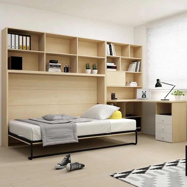 a bedroom with a bed, desk and bookshelf