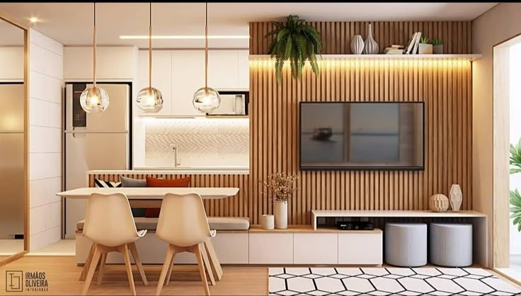 a living room filled with furniture and a flat screen tv mounted on a wall next to a kitchen