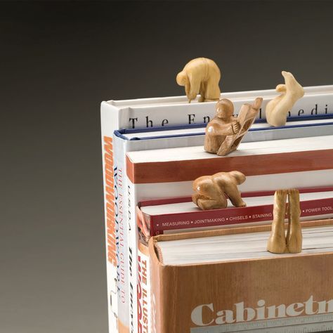 three books stacked on top of each other with animals figurines sitting on them