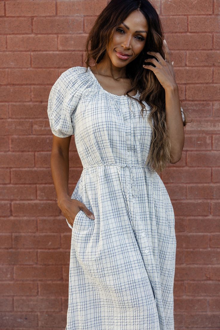 The My Girl Plaid Maxi is the perfect blend of comfort and style. It's a flowy, ankle-length dress with a soft plaid pattern that feels both classic and fresh. The dress features a relaxed, rounded neckline with subtle gathers, adding a touch of femininity. Plus, it has practical side pockets, perfect for stashing small essentials. functional buttons fully lined (unlined sleeves) pockets // paired with the free people new frontier western boots in peru Athleisure Mom, Readable Fonts, Invert Colors, Clogs Heels, Mom Accessories, Baby Gear Essentials, Ankle Length Dress, Nursing Friendly, Boys Playing