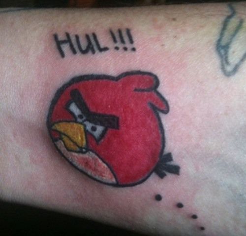 a red angry bird tattoo on the arm