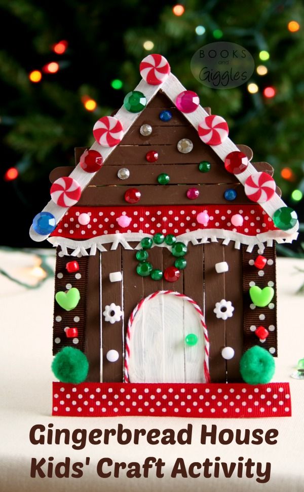 a gingerbread house is decorated with candy canes and candies for the holiday season