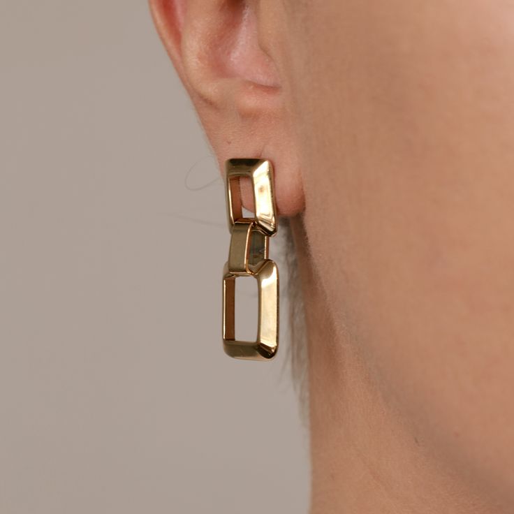 Details: Stainless steel. Water resistant. Trendy Tarnish Resistant Metal Earrings, Modern Tarnish Resistant Drop Earrings, Modern Tarnish-resistant Drop Earrings, Chic Rectangular Metal Jewelry, Trendy Rectangular Metal Jewelry, Modern Gold-tone Metal Hoop Earrings, Modern Stainless Steel Hoop Earrings For Pierced Ears, Chic Stainless Steel Tarnish Resistant Earrings, Everyday Stainless Steel Earrings With Polished Finish