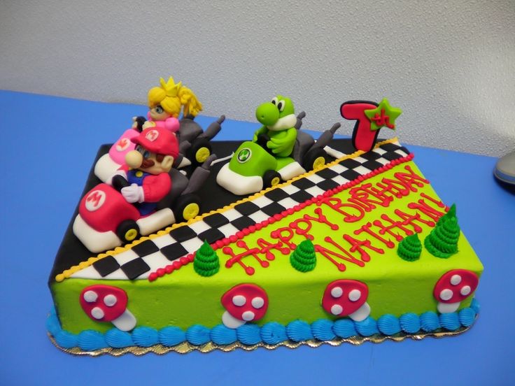 a birthday cake with mario and luigi on it