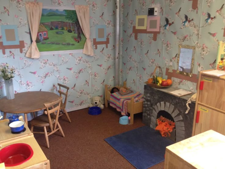 a child's playroom with toys and furniture, including a toy fire place