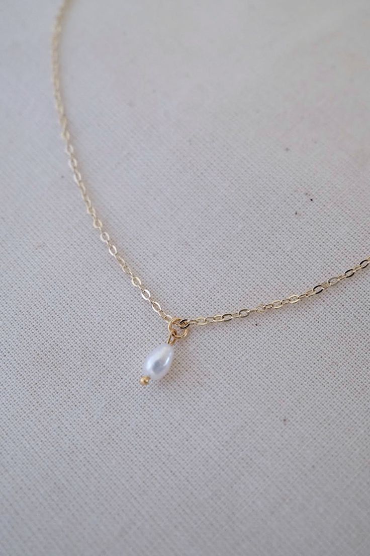 14k gold-filled dainty freshwater pearl necklace - Etsy #pearlnecklace #daintyjewelry #daintynecklace #daintypearlnecklace #necklace #necklaceoftheday #necklaceshop #necklaceoutfit #goldjewellery #goldjewelry #dainty #elegantnecklace #pearl #pearljewellery #pearljewelry #jewelryaddict #jewelrylover #jewelryforwomen #etsyshop #etsyjewelry #handmadejewelry #handmadenecklace #freshwaterpearlnecklace #aestheticnecklace #simplenecklace #goldfillednecklace #necklaceforwomen #necklaceforgirls #giftforh Delicate Teardrop Pearl Charm Jewelry, Teardrop Pearl Chain Jewelry Gift, Dainty Pearl Drop Jewelry For Anniversary, 14k Gold Filled Drop Jewelry For Anniversary, Dainty White Drop Necklace, Teardrop Pearl Charm Necklace In 14k Gold Filled, 14k Gold-filled Teardrop Necklace With Pearl Charm, 14k Gold Filled Teardrop Necklace With Pearl Charm, Dainty Teardrop Pearl Pendant Jewelry