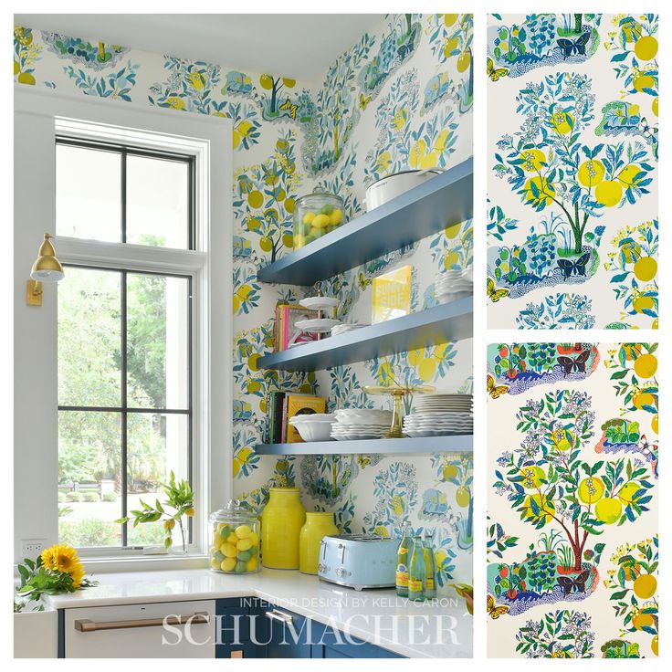 a kitchen with yellow and blue flowers on the wall, open shelvings in front of a window