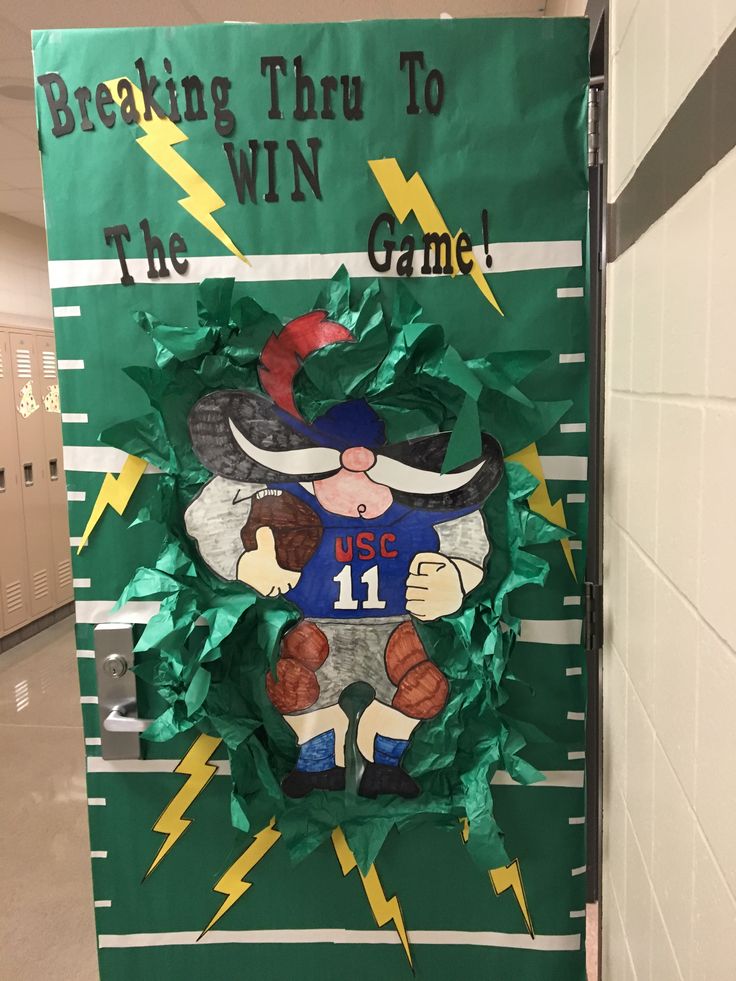 a door decorated with paper mache and green leaves that says breaking thru to the win