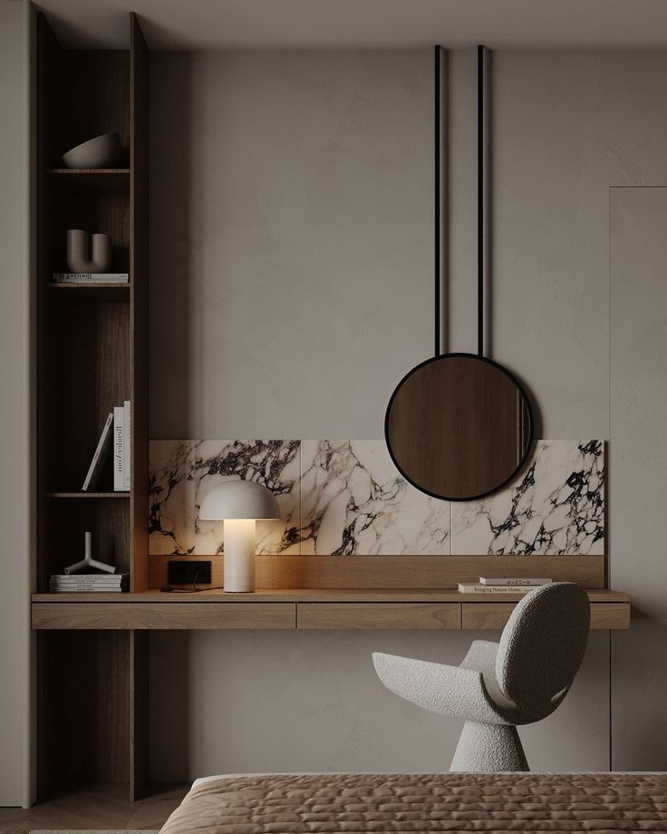 a bedroom with a bed, desk and mirror on the wall next to bookshelves