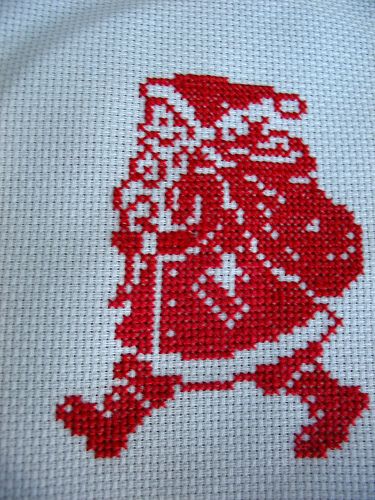 the cross stitch pattern is red and white